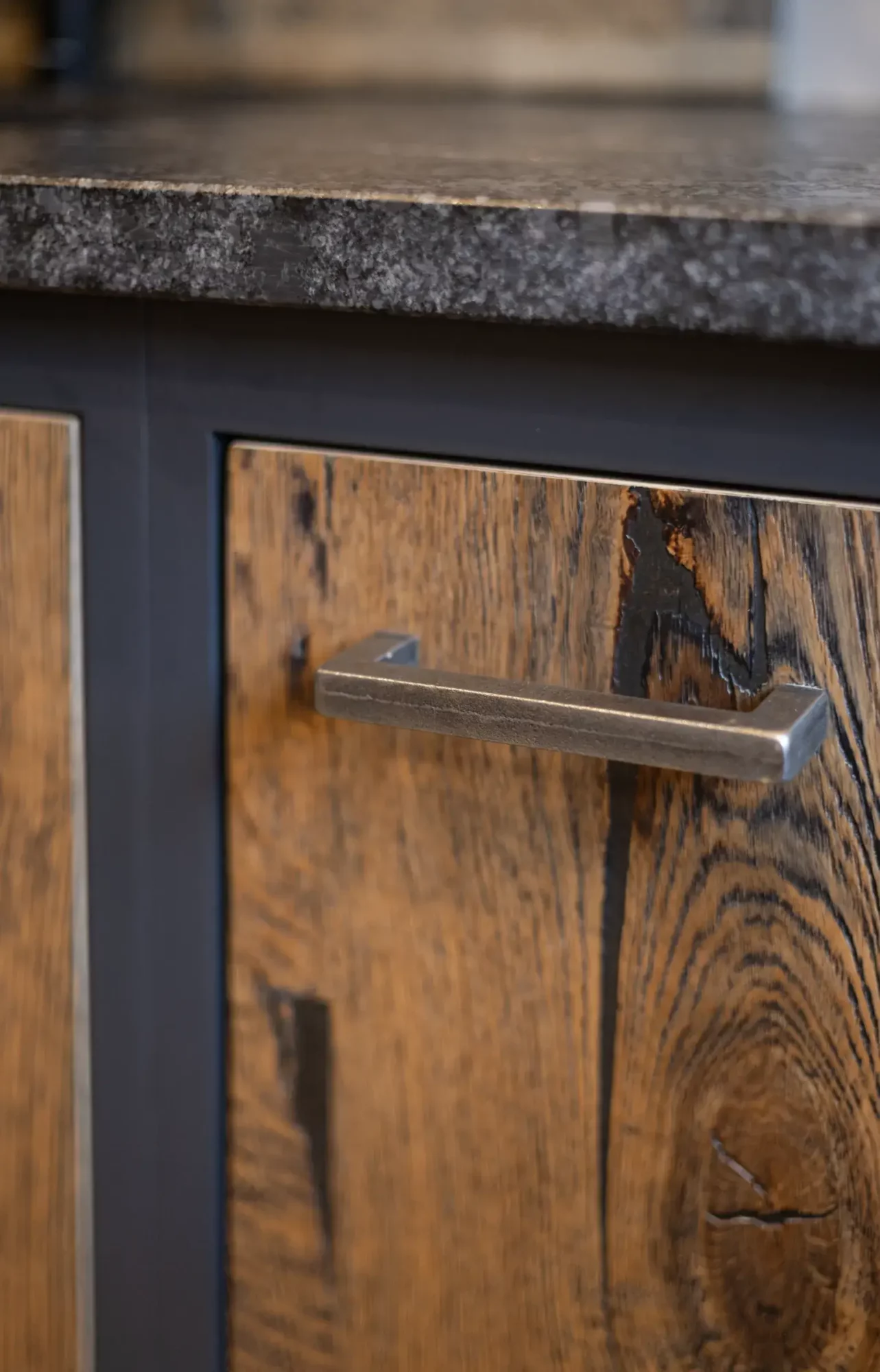 Door feature. Beamwood Jeans wood with cast Iron Handles. By Scawton Kitchens for Ten Fathoms